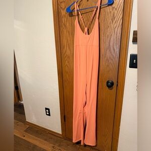 Free People Movement one piece peach jumpsuit.